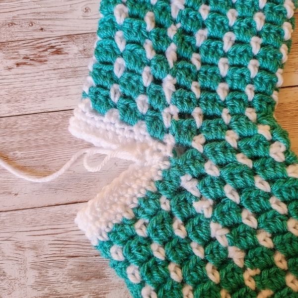 WIP of heel on Crochet Christmas Stocking Pattern, shown after a few rounds.