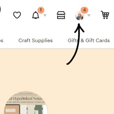 This image is a close up of the right hand corner of the screen when you're on the Etsy homepage. A black arrow points to the circle which is an icon for "Your Account".