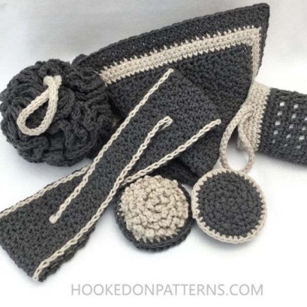 This image shows the Luxury Bathroom Spa Set by Hooked on Patterns. It shows all of the patterns included in the set, made in grey with white accents. These cute crochet projects are shown on a white background.