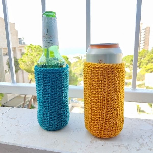 Image shows two versions of the Knit Look beer cozy, one in yellow on a tall can and one in blue on a bottle. Designed by Made by Gootie.