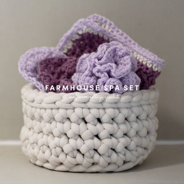This image shows the Farmhouse Spa Set by Sunflower Cottage Crochet. The spa set is shown tucked into a white crocheted basket.