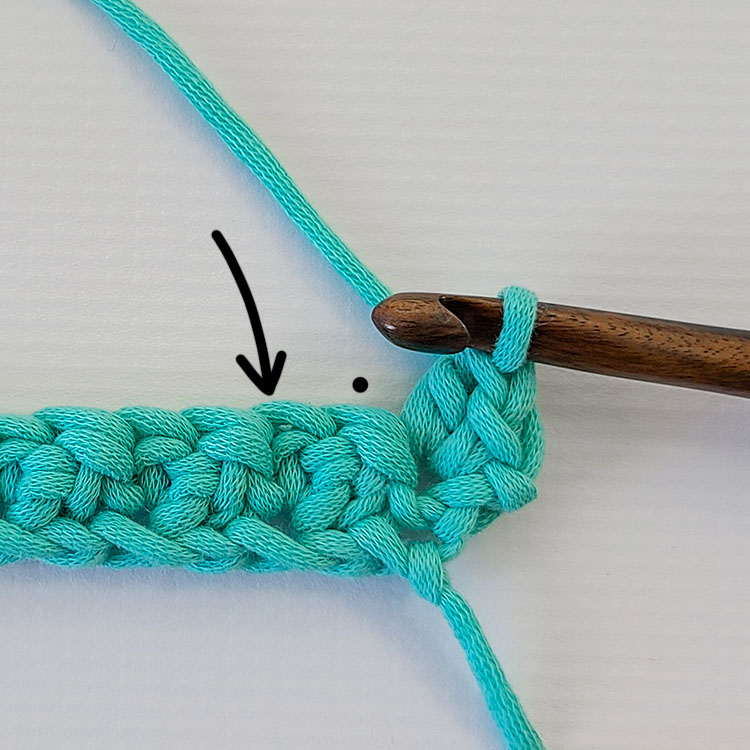 This image shows the next steps of the crochet suzette stitch as written out in the step by step instructions. The work is on a white background.