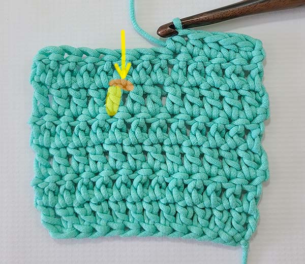 This image shows the steps as referenced in the text for how to skip stitches and then crochet 2 rows below.