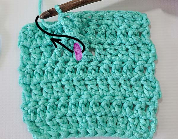 This image shows the steps as referenced in the text for how to crochet 2 rows below in the skipped stitches.