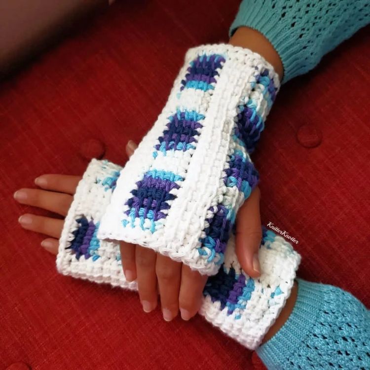 This image shows the next pattern, which is the Join Me Mitts as described above. The image shows the gloves being worn, with one hand over the wrist of the other arm.