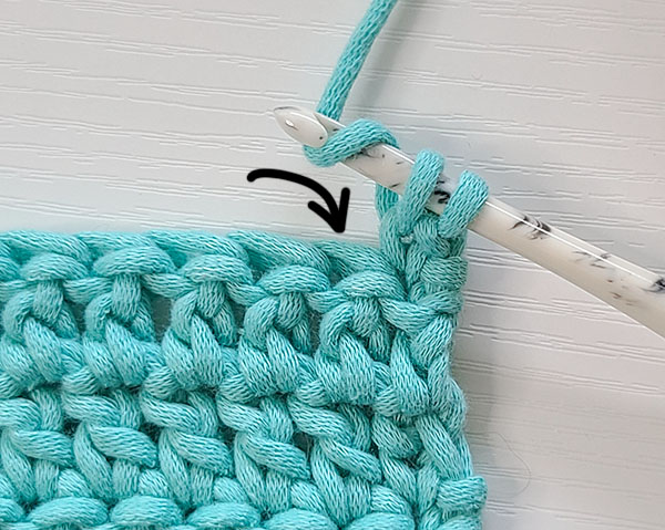 This image shows the next step in how to decrease with a standing single crochet as indicated in the written instructions.